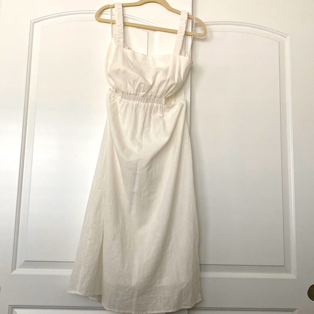 White lined linen dress, open lower back and side cut outs